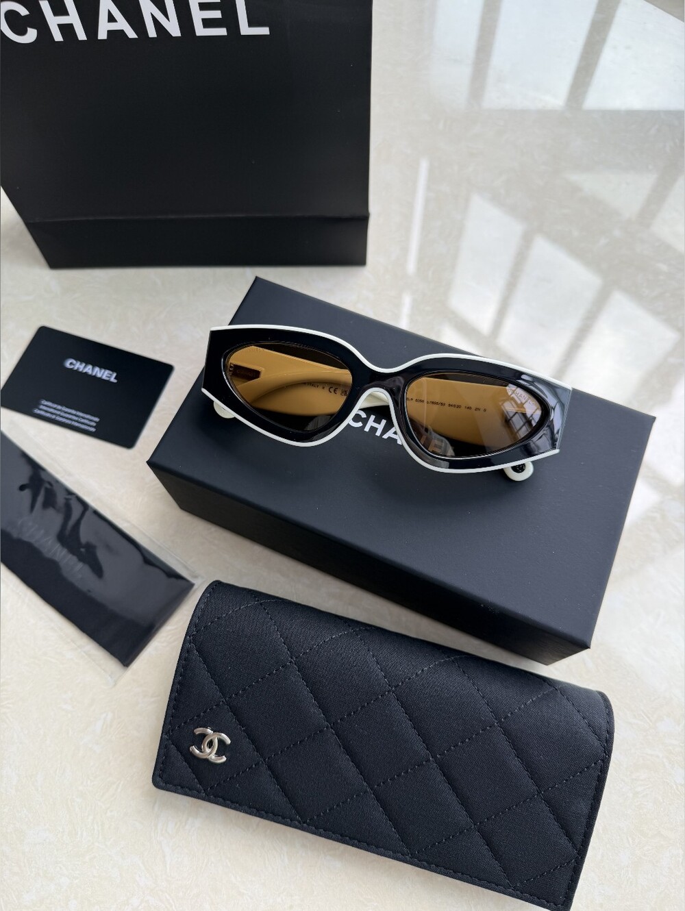 CHANEL Black and White Cat-Eye Sunglasses with Brown Lenses